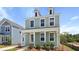 Charming two-story home with a covered front porch and a manicured lawn at 222 Terrace View Dr, Summerville, SC 29486