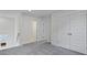 Upstairs hallway with plush gray carpeting, white trim, and a view of the bathroom and bedroom doors at 222 Terrace View Dr, Summerville, SC 29486