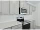 Modern kitchen with white countertops, gray cabinets, and stainless steel appliances at 222 Terrace View Dr, Summerville, SC 29486