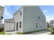 Rear exterior view featuring light siding and attached storage shed at 222 Terrace View Dr, Summerville, SC 29486