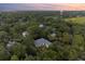 An aerial view of the property nestled among mature trees, providing privacy at 2340 Marsh Hen Dr, Seabrook Island, SC 29455