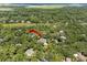 Aerial view highlighting the homes location amidst mature trees and the marsh at 2340 Marsh Hen Dr, Seabrook Island, SC 29455