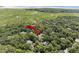 An aerial view of the property nestled among mature trees and beautiful marsh views at 2340 Marsh Hen Dr, Seabrook Island, SC 29455