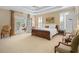 Relaxing bedroom with tray ceilings, French doors to a private porch and shuttered windows for ample light at 2340 Marsh Hen Dr, Seabrook Island, SC 29455