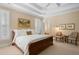 Sunlit primary bedroom features tray ceilings, neutral decor, plantation shutters and a tranquil atmosphere at 2340 Marsh Hen Dr, Seabrook Island, SC 29455