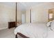 Bedroom featuring a four-poster bed, complemented by neutral décor at 2340 Marsh Hen Dr, Seabrook Island, SC 29455