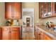 Convenient butler's pantry with wood cabinets, granite counters, and ample storage space at 2340 Marsh Hen Dr, Seabrook Island, SC 29455