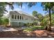 View of the home's exterior, featuring mature landscaping and an elevated structure at 2340 Marsh Hen Dr, Seabrook Island, SC 29455