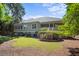Charming single-Gathering home featuring a covered porch, mature trees and lush landscaping at 2340 Marsh Hen Dr, Seabrook Island, SC 29455