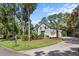 Well-maintained home showcasing lush landscaping, a private driveway, and classic shutter accents at 2340 Marsh Hen Dr, Seabrook Island, SC 29455
