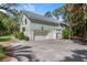 Spacious home featuring an attached garage, ample parking, and convenient side entry at 2340 Marsh Hen Dr, Seabrook Island, SC 29455
