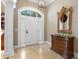 Bright foyer with tiled floors, paneled columns, a stylish mirror, and a light fixture at 2340 Marsh Hen Dr, Seabrook Island, SC 29455