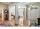 Grand foyer featuring hardwood floors, decorative columns, and a dining area at 2340 Marsh Hen Dr, Seabrook Island, SC 29455