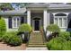 Beautiful entryway with brick steps, lush greenery, and a stately front door at 2340 Marsh Hen Dr, Seabrook Island, SC 29455