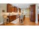 Charming kitchen with wooden cabinetry, granite countertops, stainless steel appliances, and island at 2340 Marsh Hen Dr, Seabrook Island, SC 29455