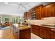 Gourmet kitchen with custom wood cabinets, granite counters, a center island and stainless steel appliances at 2340 Marsh Hen Dr, Seabrook Island, SC 29455