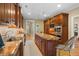 Bright kitchen showcasing wooden cabinetry, granite countertops, stainless appliances, and central island at 2340 Marsh Hen Dr, Seabrook Island, SC 29455