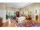 Spacious living room with hardwood floors, comfortable seating, fireplace, and large windows at 2340 Marsh Hen Dr, Seabrook Island, SC 29455