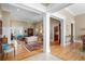 Bright and open-concept living room featuring wood floors, beautiful columns, and stylish furniture at 2340 Marsh Hen Dr, Seabrook Island, SC 29455