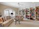 Living room with lots of natural light, plush sofas and custom built-in shelving at 2340 Marsh Hen Dr, Seabrook Island, SC 29455