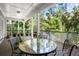 Inviting covered patio area with outdoor seating, offering a relaxing space to enjoy the serene surroundings at 2340 Marsh Hen Dr, Seabrook Island, SC 29455