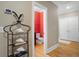 View of powder room with red wall paper, toilet and decorative rack with shells at 2340 Marsh Hen Dr, Seabrook Island, SC 29455