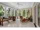 Inviting sunroom with large windows providing scenic views of the surrounding nature at 2340 Marsh Hen Dr, Seabrook Island, SC 29455