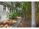 Side yard features mulch landscaping and pathway through bamboo at 2340 Marsh Hen Dr, Seabrook Island, SC 29455