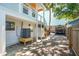 Backyard of a multi-level home showing outdoor shower, carport, and exterior staircases at 2407 Cameron Blvd, Isle of Palms, SC 29451