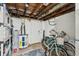 Unfinished basement featuring the water heater, bicycles, and shelving units at 2407 Cameron Blvd, Isle of Palms, SC 29451