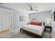Comfortable bedroom with stylish rug, ceiling fan, and abundant natural light at 2407 Cameron Blvd, Isle of Palms, SC 29451