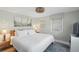 Well-lit bedroom features a comfortable king bed, beach decor, and stylish lighting at 2407 Cameron Blvd, Isle of Palms, SC 29451