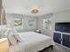 Calm bedroom with white bedding, two windows, and beach-themed decor at 2407 Cameron Blvd, Isle of Palms, SC 29451