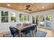 Bright dining room with wood ceiling, large windows, and access to outdoor area at 2407 Cameron Blvd, Isle of Palms, SC 29451