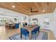 Open concept living space with dining area, showcasing wood ceiling, and seamless transition to the kitchen at 2407 Cameron Blvd, Isle of Palms, SC 29451