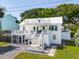 Elegant two-story home with a private screened porch, a patio, and a meticulously manicured lawn at 2407 Cameron Blvd, Isle of Palms, SC 29451