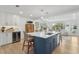 Beautiful kitchen featuring a large island with seating, custom cabinetry and a wine fridge at 2407 Cameron Blvd, Isle of Palms, SC 29451