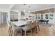 Modern kitchen with a large island, stainless steel appliances, and an adjacent dining area at 2407 Cameron Blvd, Isle of Palms, SC 29451