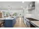 Open concept kitchen featuring a large island, modern appliances, and hardwood flooring at 2407 Cameron Blvd, Isle of Palms, SC 29451