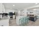 Open concept kitchen with breakfast bar, stainless steel appliances, and easy access to living room at 2407 Cameron Blvd, Isle of Palms, SC 29451