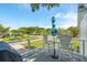 Relaxing patio seating with view of the manicured lawn at 2407 Cameron Blvd, Isle of Palms, SC 29451