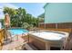 Relaxing backyard features a sparkling pool and a luxurious hot tub on a wooden deck at 2407 Cameron Blvd, Isle of Palms, SC 29451