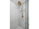 Modern shower featuring a large rain shower head and gray and white subway tile walls at 2407 Cameron Blvd, Isle of Palms, SC 29451