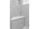 Stylish shower featuring a built-in bench and sleek gray subway tile walls at 2407 Cameron Blvd, Isle of Palms, SC 29451