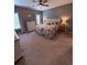 Comfortable bedroom with a queen-sized bed, soft lighting, and neutral décor, ready for relaxation at 2460 Bama Rd, Cottageville, SC 29435