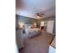 Comfortable bedroom with queen-sized bed, ceiling fan, dresser, and views of the bathroom at 2460 Bama Rd, Cottageville, SC 29435