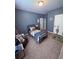 Charming bedroom with blue walls, playful decor and a cozy rug at 2460 Bama Rd, Cottageville, SC 29435
