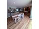 Dining room table and view of kitchen and living room at 2460 Bama Rd, Cottageville, SC 29435