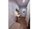 Inviting entryway featuring wood floors, a storage bench, and decorative wall hooks at 2460 Bama Rd, Cottageville, SC 29435