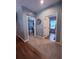 Open hallway with hardwood floors and a view of a bedroom at 2460 Bama Rd, Cottageville, SC 29435